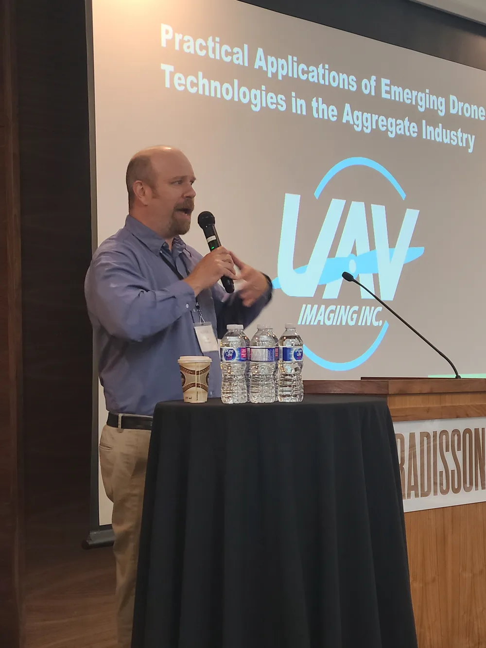 Jason Field of UAV Imaging presenting Practical Applications of Emerging Drone Technologies in the Aggregate Industry to an audience.